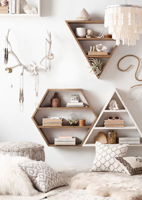 Geometric wall mounted shelves can be not only storage units but also cool decor items, too