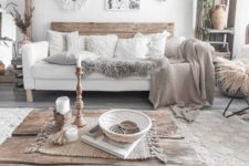 12 a boho living room with much wood, knit, crochet and jute that make up the whole style of this free-spirited space