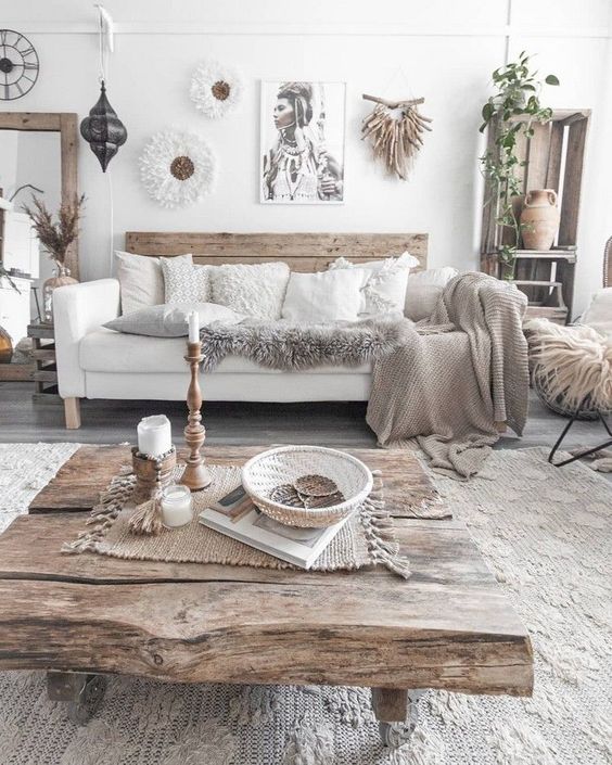 a boho living room with much wood, knit, crochet and jute that make up the whole style of this free-spirited space