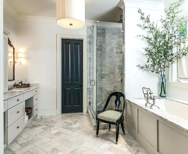 a single black door echoing a refined chair make a boring and traditional bathroom refined and catchy