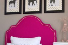 13 an IKEA Tarva bed with a bright pink upholstered headboard lined up with decorative nails