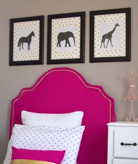 an IKEA Tarva bed with a bright pink upholstered headboard lined up with decorative nails
