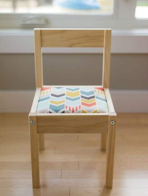 an IKEA Latt chair with a soft seat made of foam and bright printed fabric to make the piece more comfortable