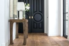 14 various types of doors painted black and spruced up with chic handles and knobs will bring elegance to your space