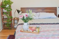 16 a bright bedroom with colorful bedding and a bold printed rug that give interest to the room