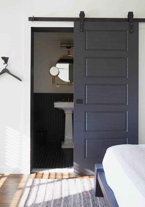 a graphite grey door won't have that much impact as a black one but it's still a bold and edgy solution to try
