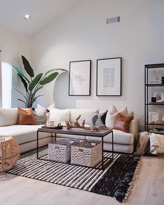 rugs, baskets and pillows of leather and crochet make the living room super chic and cool