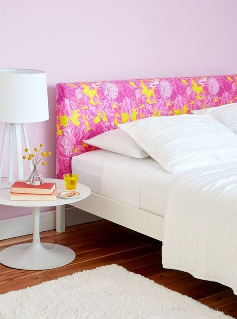 an IKEA Malm bed frame with a headboard hacked with colorful fabric for a touch of color