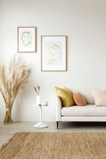 velvet throws, pampas grass and a jute rug make the living room super catchy and cool