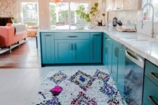 18 a bright printed rug and blue cabinets work well together giving the home a wild feel