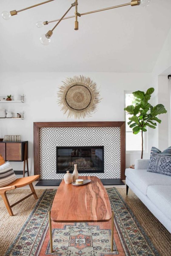 An eclectically styled living room with mid century modern and boho items and furniture