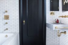 21 a chic monochromatic bathroom with patterned tiles, a black door and a ceiling for a bold look
