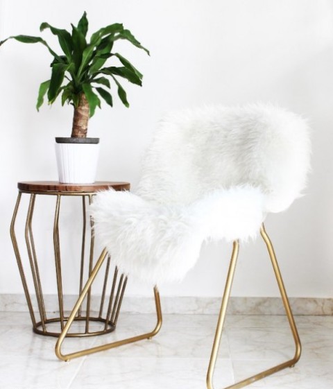 an IKEA Snille chair hack with gold spray paint and faux fur results is a very glam piece