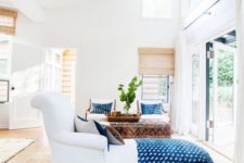 22 a dreamy Californian space with bold blue linens and touches of natural wood and jute