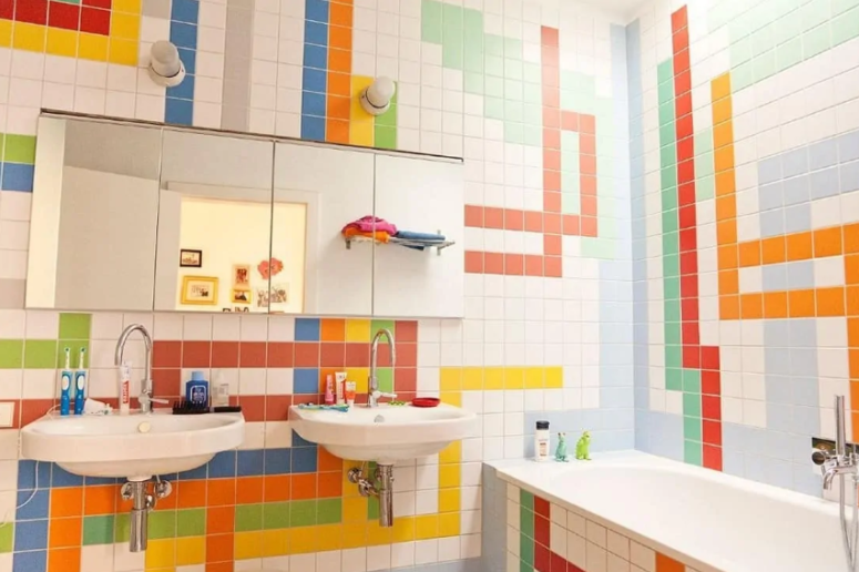 a colorful bathroom with bright tiles done in geometric patterns on the walls is a cool and cheerful idea