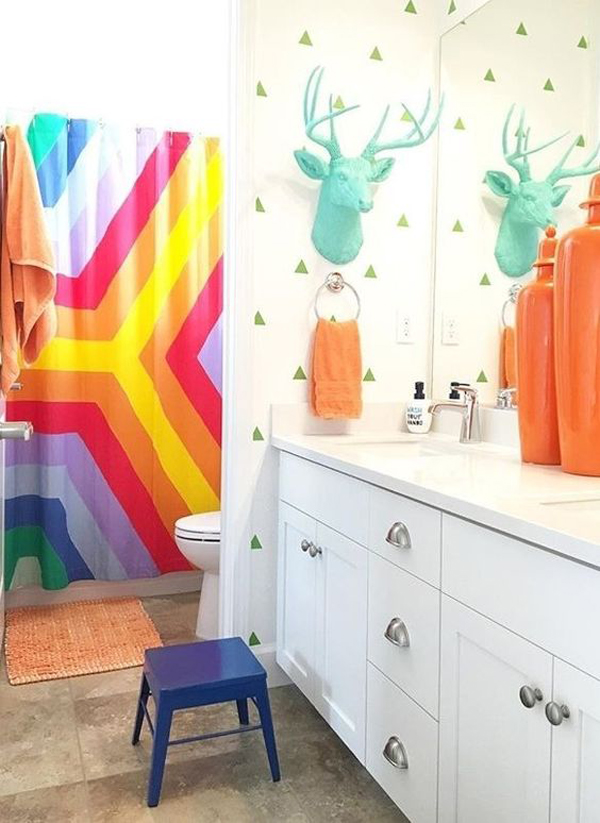 a faux turquoise deer head, colorful towels and a super bright shower curtain will turn a simple bathroom into a kids' one