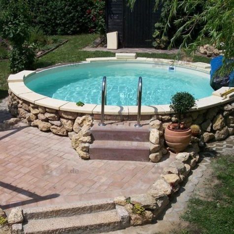 a large round pool clad with tiles and stone and with a brick deck next to it is a traditional otudoor feature to try