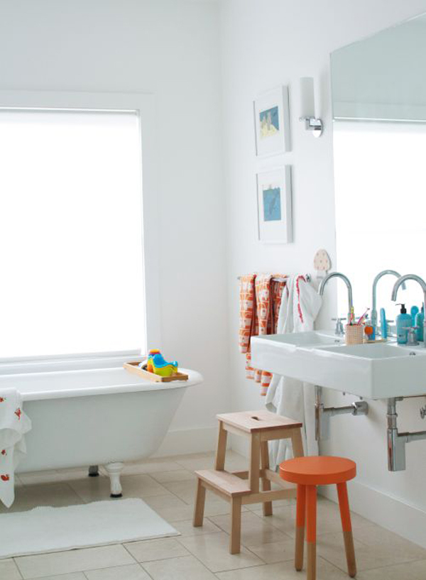 a neutral bathroom made fun and cheerful with colorful kids' accessories and furniture in all kinds of shades