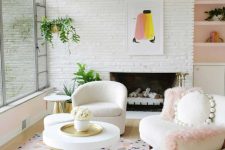 a playful living room with a glazed wall, a fireplace, a white boucle sofa with pillows, a curved chair and a terrazzo print rug