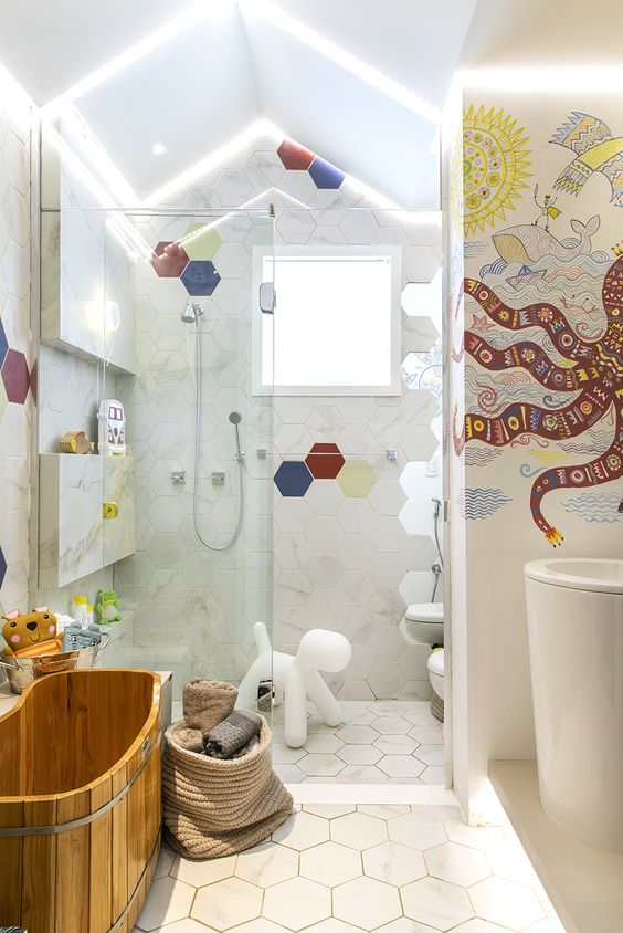 colorful hexagon tiles and a bright octopus mosaics on the wall, fun toys to make the bathroom cooler
