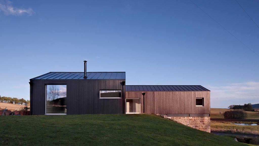 This contemporary home is built on top an old granite mill in Scotland
