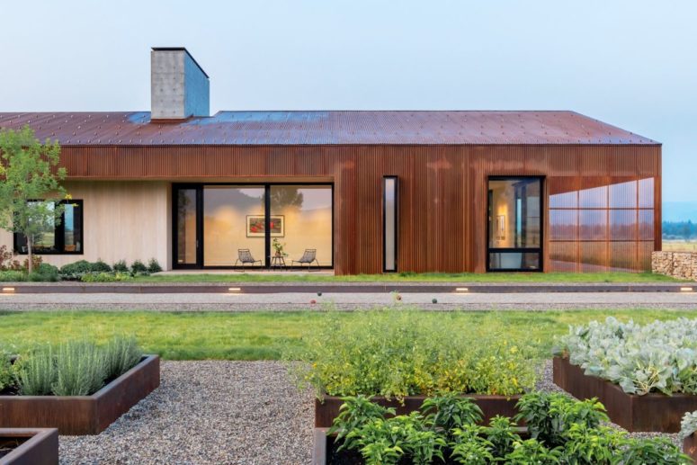 This home isn't your average barn, it's a modern take on it clad with oxidzed steel frames and with a series of openings