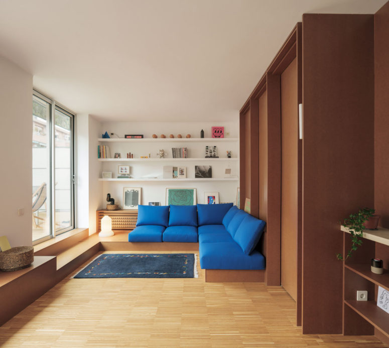 This modern apartment is a small attic of just 70 square meters and to make it effective and practical, the designers went for built in furniture