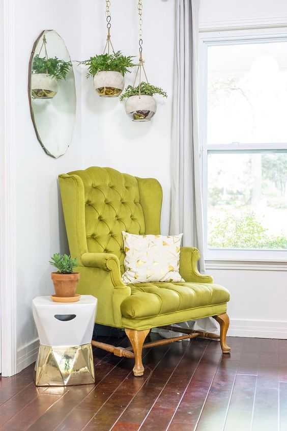 A bright modern nook with a vintage inspired neon green chair that sets the tone in the space