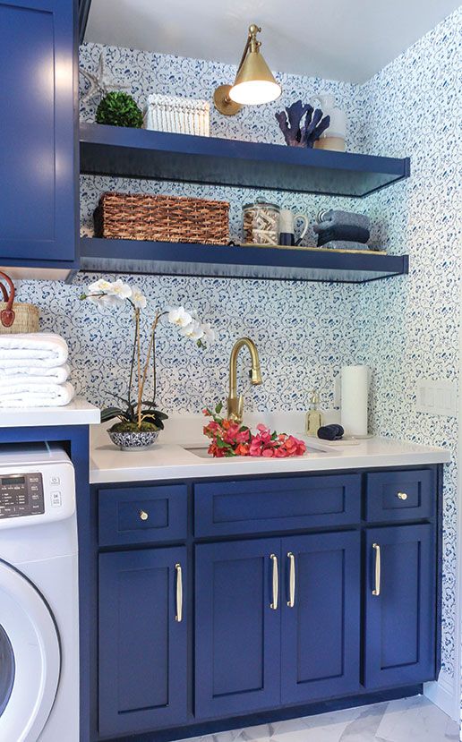 a tiny kitchen done with blueberry blue cabinets, shelves and white to maximize