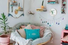 06 a colorful boho nook with a papasan chair with pastel pillows, a macrame chandelier and potted greenery and bright touches