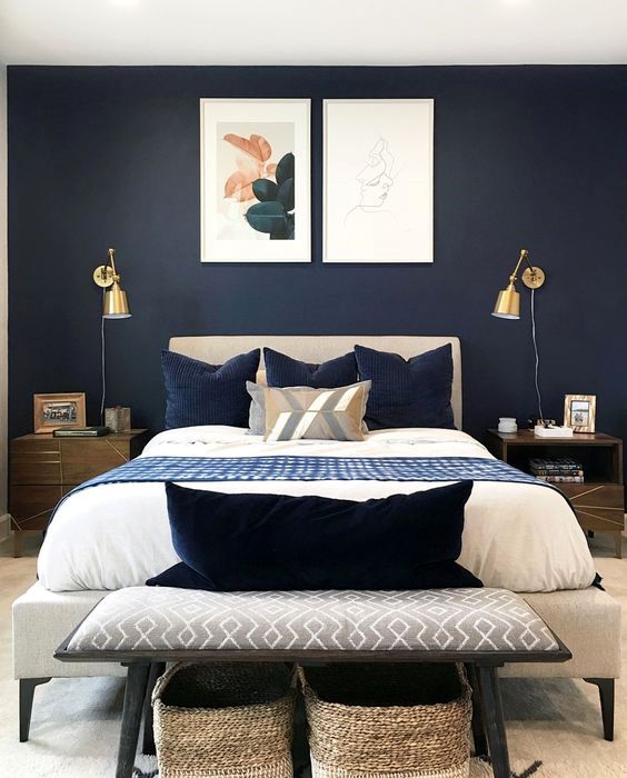 a mid-century modern bedroom with gold wall sconces is a cool space with a shiny touch