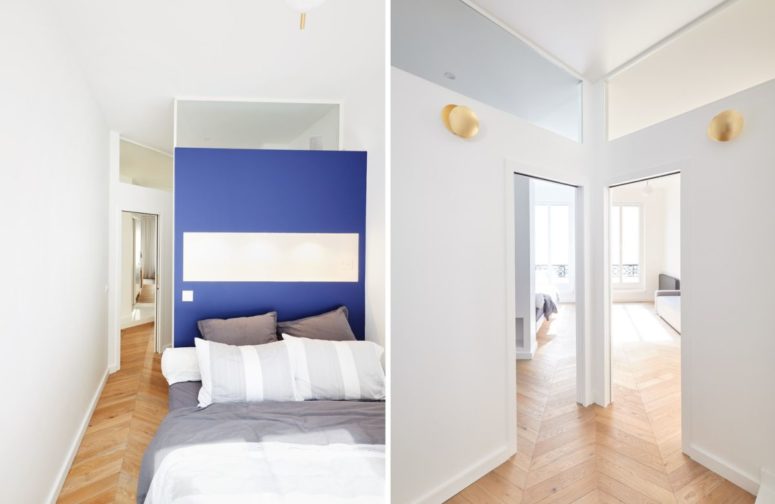 This is another bedroom, with a blue accent wall and a bed - it's light-filled like most of other spaces