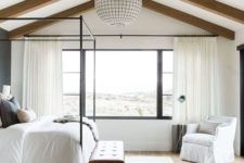 12 a neutral farmhouse bedroom with wooden beams on the ceiling and a statement sphere lamp