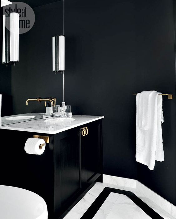 a tiny powder room with onyx walls, white stone for a contrast and a floating black vanity for a shiny touch