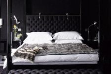 16 a black bedroom with a refined crystal chandelier that illuminates the space making it wow