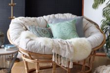 16 a gorgeous rattan mamasan chair with a neutral futon and pastel and printed pillows for a neutral boho space