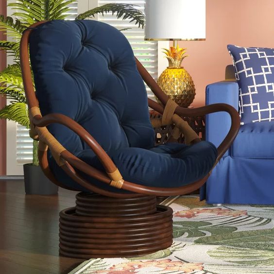 a dark swivel papasan rocker chair with navy upholstery is a cool idea that combines two different chairs in one