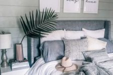 24 a boho bedroom in neutrals with an upholstered bed and some matching throws but of different fabric
