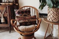 24 a rattan swivel rocker chair with boho pillows and rugs is a cool idea to finish off a boho space