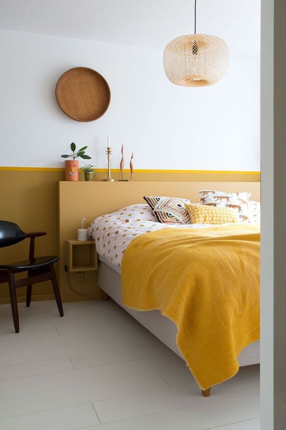 a small yet contrasting bedroom made bright with marigold and mustard and refreshed with neutrals