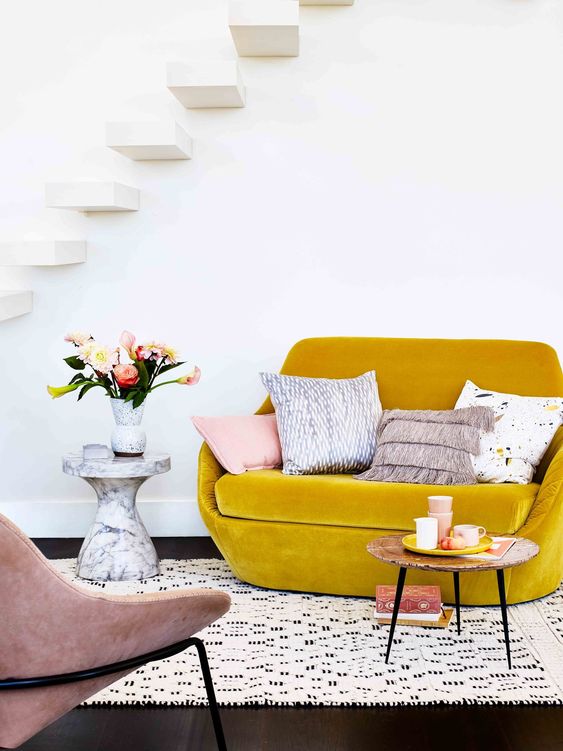 finish off your small living room with a mustard velvet loveseat to add color and texture to the space