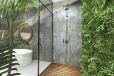 a biophilic bathroom with a living wall in the shower space and a part of it outdoors for more connection to nature
