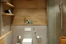 a minimalist bathroom with wooden walls