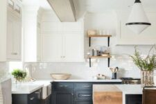 a contrasting kitchen with white upper cabinets and graphite grey lower ones, light colored wood touches