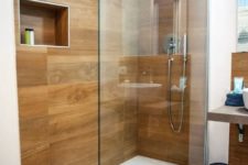 a stylish minimalist bathroom with awesome wood tiles