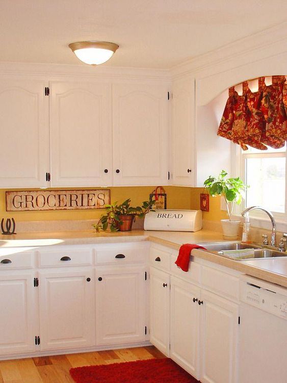 a vintage kitchen in white, a yellow kitchen backsplash and vintage touches plus bright shades for a bolder look