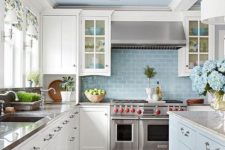 an elegant powder blue and white kitchen with touches of metallic shades and floral patterns for a chic look