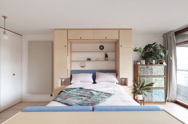The Murphy bed folds down with ease and there are little slots on either side that become nightstands