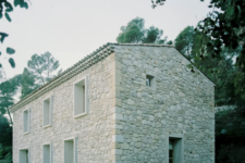 02 The house resembles a stone barn, there are many windows to bring light in and glazed doors