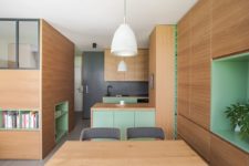 02 The whole apartment is done in light-colored oak, with touches of bright green